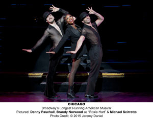 Brandy Norwood as Roxie Hart, with Denny Paschall (l.) and Michael Scirrotto (r.)