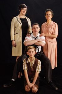 Alicia Sweeney (left) as Luisa, Jason Vellon (center back) as Guido Contini, Jackson Parlante (center front) as Young Guido, and Susan S. Porter (right) as Mama Contini in Nine