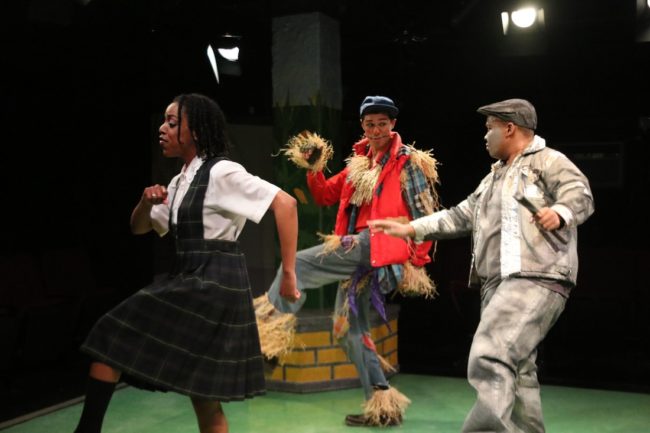 Amber Hooper (left) as Dorothy, Justin Johnson (center) as Scarecrow, and Shae Henry (right) as TinMan in The Wiz