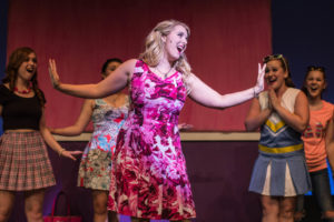 Clare Kneebone (center) as Elle Woods