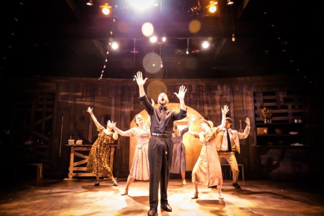 Jonathan M. Rizzardi (center) as The Preacher and the ensemble of Bonnie & Clyde