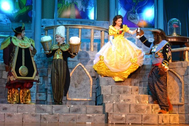 (L to R) Cameron Casey as Cogsworth, Henry Cyr as Lumiere, Ilyssa Rubin as Belle, and Tom Zepp as The Beast