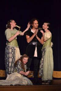 Matthew Lamb (center) as Gaston with Compton Little, Brooke Nixon, and Lillian Stoneberger as The Silly Girls