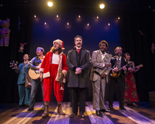 (L to R) Karen Lange as 'Sara Jane Moore,' Taylor Rieland as 'John Hinckley,' Tyler Cramer as 'Samuel Byck,' Andrew Keller as 'John Wilkes Booth,' Topher Williams as 'Guiseppe Zangara,' Zach Brewster-Geisz as 'Charles Guiteau,' and Alex Palting as 'Squeaky Fromme' in Assassins produced by Pallas Theatre Collective.