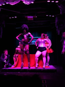 Diamond Taylor (left-center) as Dr. Frank N. Furter and Tapitha Kix (right-center) as Columbia