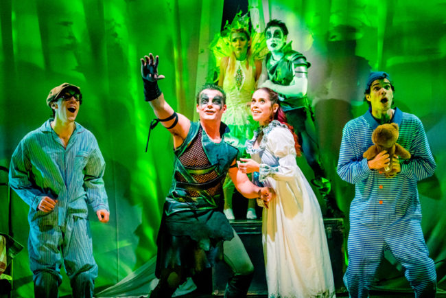 Alex Mills (center left) as Peter Pan and Kathy Gordon (center right) as Wendy Darling