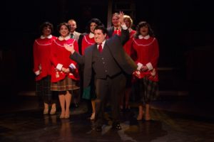 Tommy Malek (center) as Marvin Shellhammer with the ensemble of Miracle on 34th Street