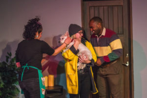 Maranda Kosten (left) as Mona, Caitlin Rife (center) as Shanna, Lucy Bond (being held by Caitlin Rife) as Scout, and Ramon Burris (right) as Lucas in The Well by Rich Espey