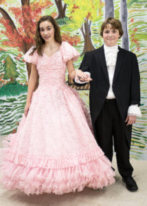 Olivia Lockett (left) as Isabelle and Gregory Areford (right) as Young Ebenezer