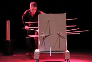 Sam Strange performing the infamous "Cardboard Box" illusion with Richard Young inside the box