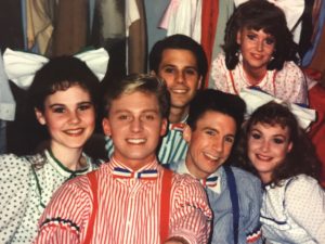 Jeffrey Shankle (front, center) as Tommy Djilas with Mark Minnick (back, center) and David James (right, center) as dancing boys in The Music Man at Burn Brae Dinner Theatre some time ago