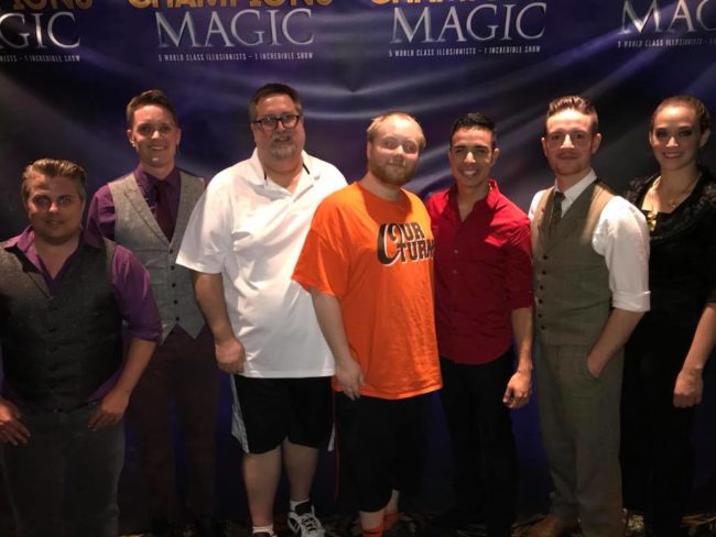 Reviewer Mike Zelhoffer (center left) and son William Zelhoffer (center right) with the magicians of Champions of Magic