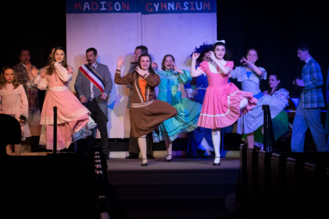 Grace Volpe (center left) and Olivia Winter (center right) sharing the role of Zaneeta in The Music Man