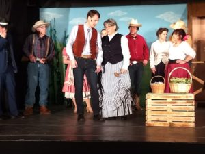 Joe Weinhoffer (center left) as Will Parker and Donna Zubrowski (center right) as Aunt Eller and the ensemble