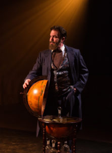 Russell Sunday as Joseph Pulitzer in Newsies at Toby's Dinner Theatre