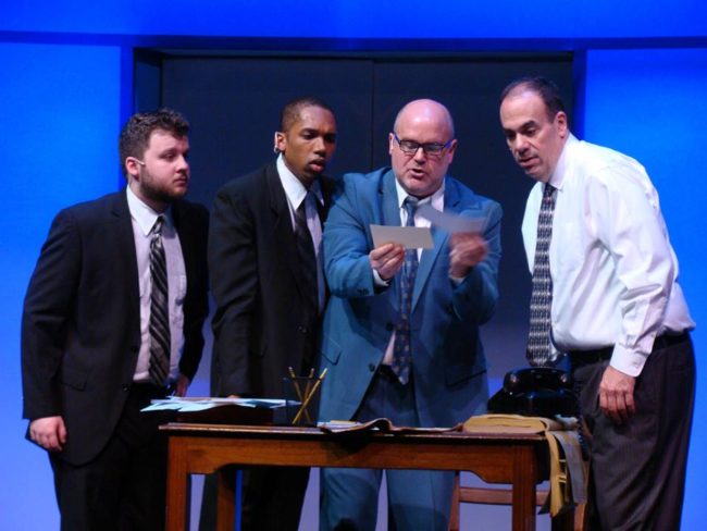 (L to R) Zach Husak as Agent Cod, Derek Cooper as Agent Dollar, Steve Antonsen as Carl Hanratty, and Roger Schulman as Agent Branton