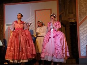 Talia Katz (left) as Florinda, Nampoina Randrianarivelo (center) as Cinderella, and Sallie Ratrie (right) as Lucinda in Into the Woods