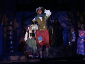 Tyler White (forward center) as Jack and Elizabeth Kenner (backward center) as Jack's Mother