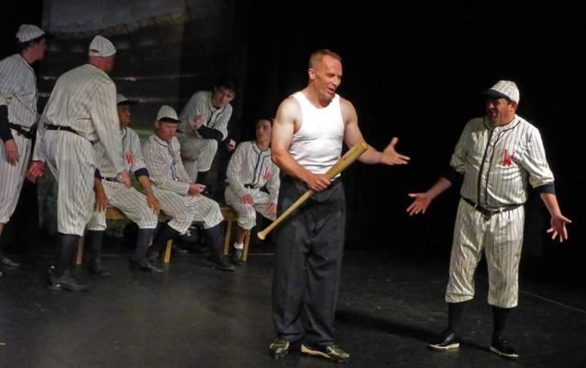 Joe Rose (center) as Joe Hardy and the ensemble of Damn Yankees