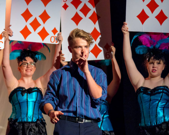 Nick Zuelsdorf (center) as Jack Singer and the ensemble of Honeymoon in Vegas