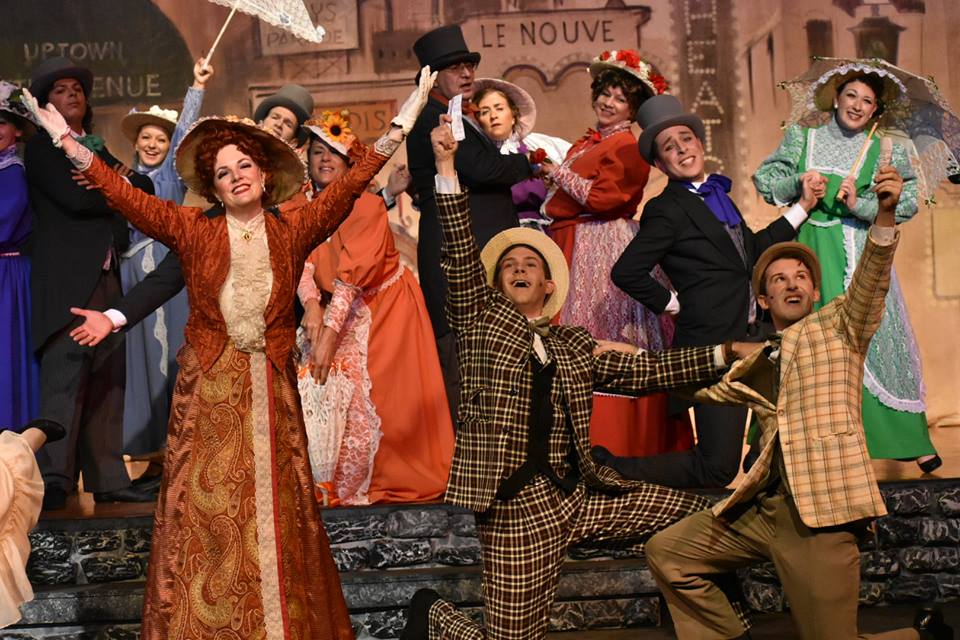 Dawn O'Croinon (front left) as Dolly Levi, Stephen Strosnider (front center) as Cornelius Hackl, and Mark Quackenbush (front right) as Barnaby Tucker in Hello, Dolly!