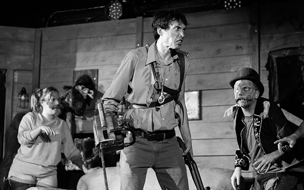 Ellen Manuel (left) as Kandarian Demon with Michael Bliss (center) as Ash, and Rance Denton (right) as MC Kandarian Demon in Evil Dead: The Musical