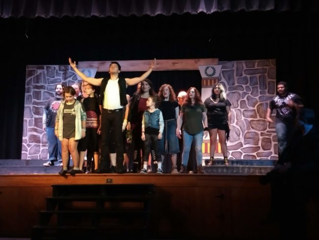 Luis "Matty" Montes (center) as Jesus of Nazareth in Jesus Christ Superstar and the ensemble at Just Off Broadway