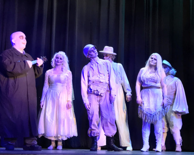 (L to R) Michael Crook as Uncle Fester, and Addams Ancestors Maggie Mellott, Justin Moe, Billy Luzier, Parker Bailey Steven, Derek Anderson