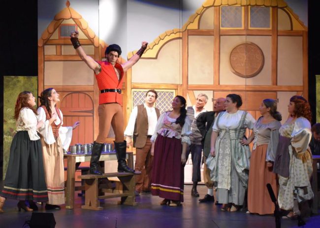 Clay Comer (center) as Gaston with the cast of Beauty & The Beast at Damascus Theatre Company