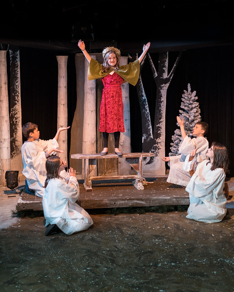 Claire Gunthert (center) as Magda and the children of the pageant. Photo by Harvey Levine