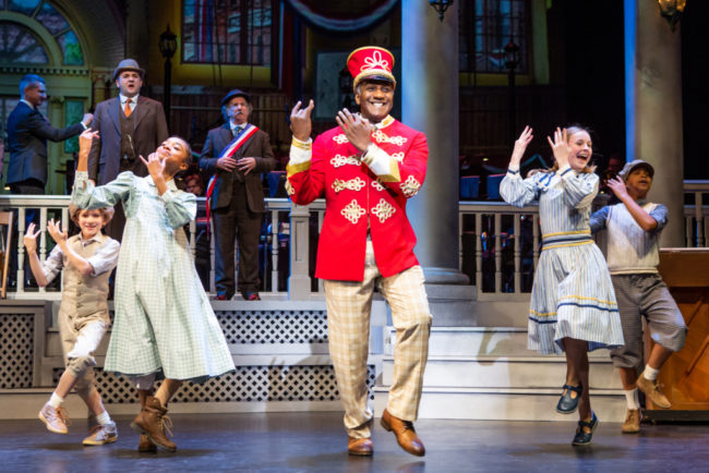 Norm Lewis (center) as Prof. Harold Hill and the River City Children in The Music Man Photo: Jeremy Daniel