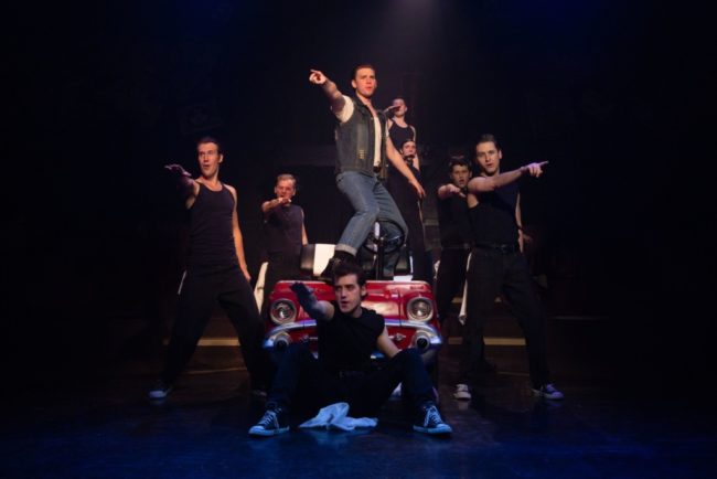 Paul Roeckell (center) as Kenickie and the Greasers at Toby's Dinner Theatre. Photo: Jeri Tidwell Photography