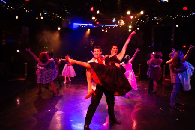 Matt Hirsh (left) as Danny and Maggie Dransfield (right) as Rizzo and the cast of Grease. Photo: Jeri Tidwell Photography.