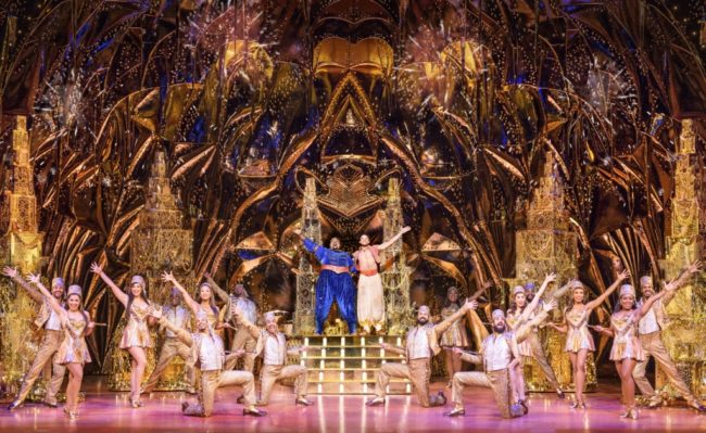 Major Attaway (center left) as Genie and Clinton Greenspan (center right) as Aladdin and company in Disney's Aladdin. Photo: Deen van Meer