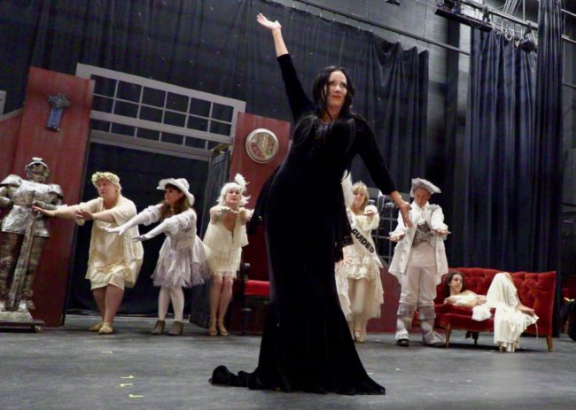 Michele Guyton (center) as Morticia Addams and The Ancestors. Photo: Tom Littlejohn