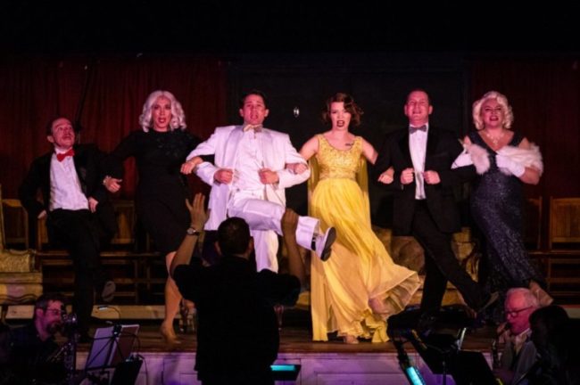 (L to R) Matt Wetzel as Josephus Gage, Beth Cohen as Mrs. Spofford, Justin Moe as Henry Spofford, Heather Moe as Dorothy Shaw, Jeremy Goldman as Gus Esmond, and Maddie Bohrer as Lorelei Lee in Gentlemen Prefer Blondes. Photo: Stasia Steuart Photography