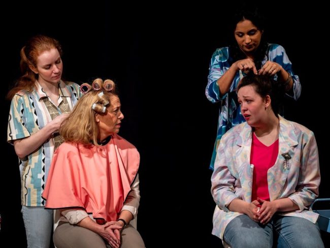 Robin Roper (left, standing) as Annelle, Jill E. Goodrich (left, seated) as M'Lynn, Divya Pereira (right, standing) and Rachel Heney (right, seated) as Shelby in Steel Magnolias.