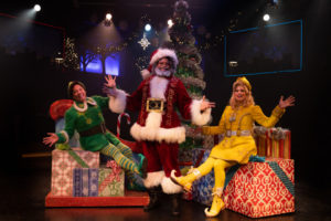 (L to R) Jeffrey Shankle as Buddy the Elf, DeCarlo Raspberry as Santa, and MaryKate Brouillet as Jovie. Photo: Jeri Tidwell Photography