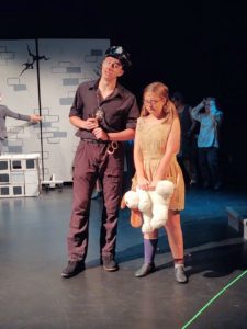 James MacLellan (left) as Officer Lockstock with Sophie Quirk (right) as Lil Sally in Urinetown.