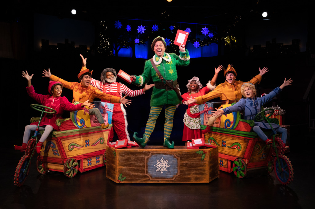 Jeffrey Shankle (center) as Buddy and the cast of Elf. Photo: Jeri Tidwell Photography