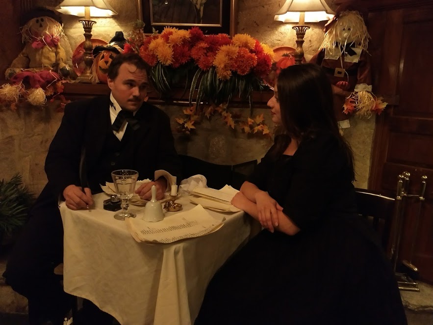 John Kelso (left) as Poe and Lauren Engler (right) as The Barmaid. 