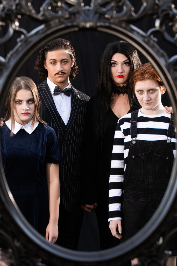 (L to R) Rosalie Hess as Wednesday Addams, Liam O'Toole as Gomez Addams, Erica Yamaner as Morticia Addams, Teaghan McLaughlin as Pugsley Addams. Photo: Wendy Hickok Photography