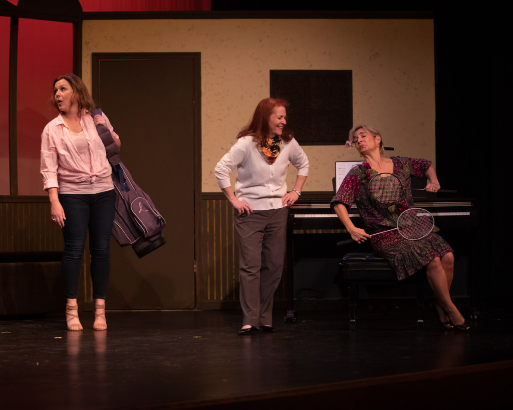 Ande Kolp (left) as Celia, with Julie Press (center) as Annie, and Debbie Mobley (right) as Chris in Calendar Girls. 📸 Delinde Photography