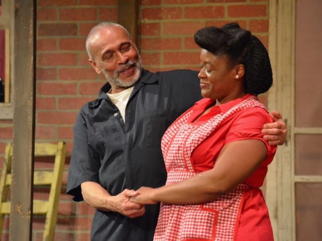 Louis B. Murray (left) as Troy and JoAn Monplaisir (right) as Rose in August Wilson's Fences. 📸 Reed Sigmon