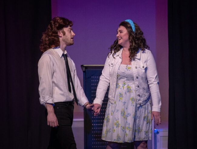 Xander Conte (left) as Robbie Hart and Maddie Bohrer (right) as Julia in The Wedding Singer. 📸Ana Johns