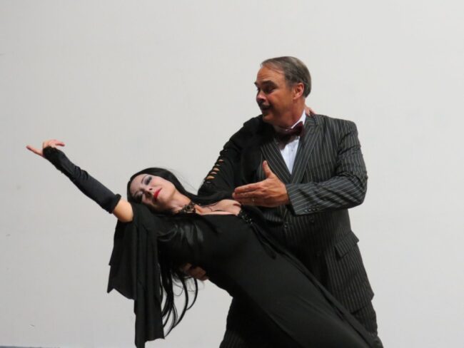 Michele Guyton (left) as Morticia and Greg Guyton (right) as Gomez Addams. 📷 Cathy Herlinger