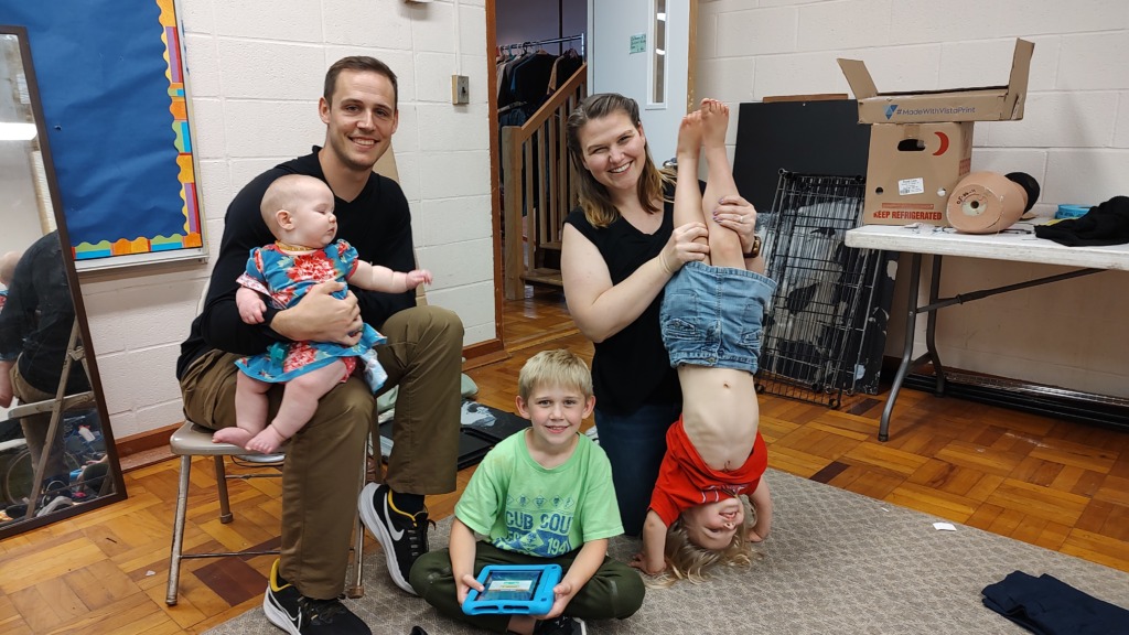 The Wojciehowski Family (L to R) DJ with baby Rosie, Joel, Andrea, and Livvy at rehearsal for Guys & Dolls with Third Wall Productions