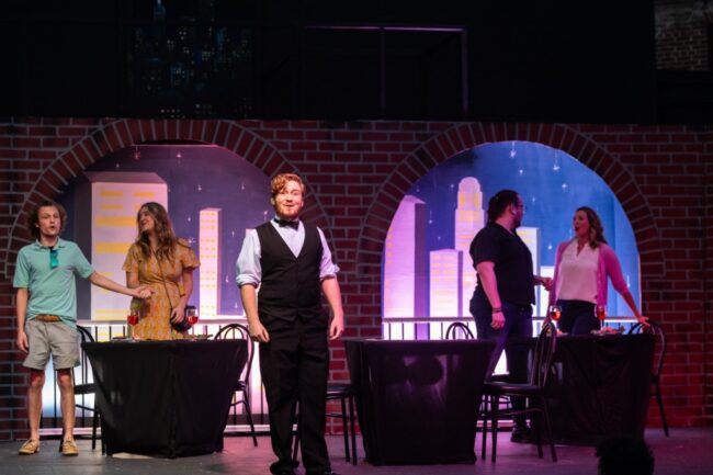 Blake Martin (center) as The Waiter in First Date 📸 Alison Harbaugh, Sugar Farm Productions