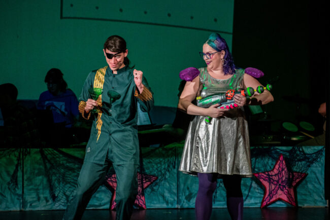 Adam Goldsmith (left) as Plankton and Jessica Long (right) as Karen in The SpongeBob Musical at Silhouette Stages. 📷 Stasia Steuart Photography