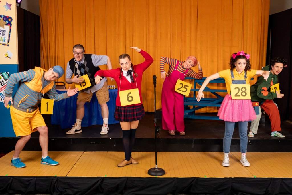 (L-R) Preston Grover (Chip), Stephen Emery (Barfée), Cera Baker (Marcy), Taylor Litofsky (Logainne), Taylor Litofsky (Logainne), and Sam Slottow (Leaf) in The 25th Annual Putnam County Spelling Bee, presented by Compass Rose Theater 📷 Joshua Hubbell